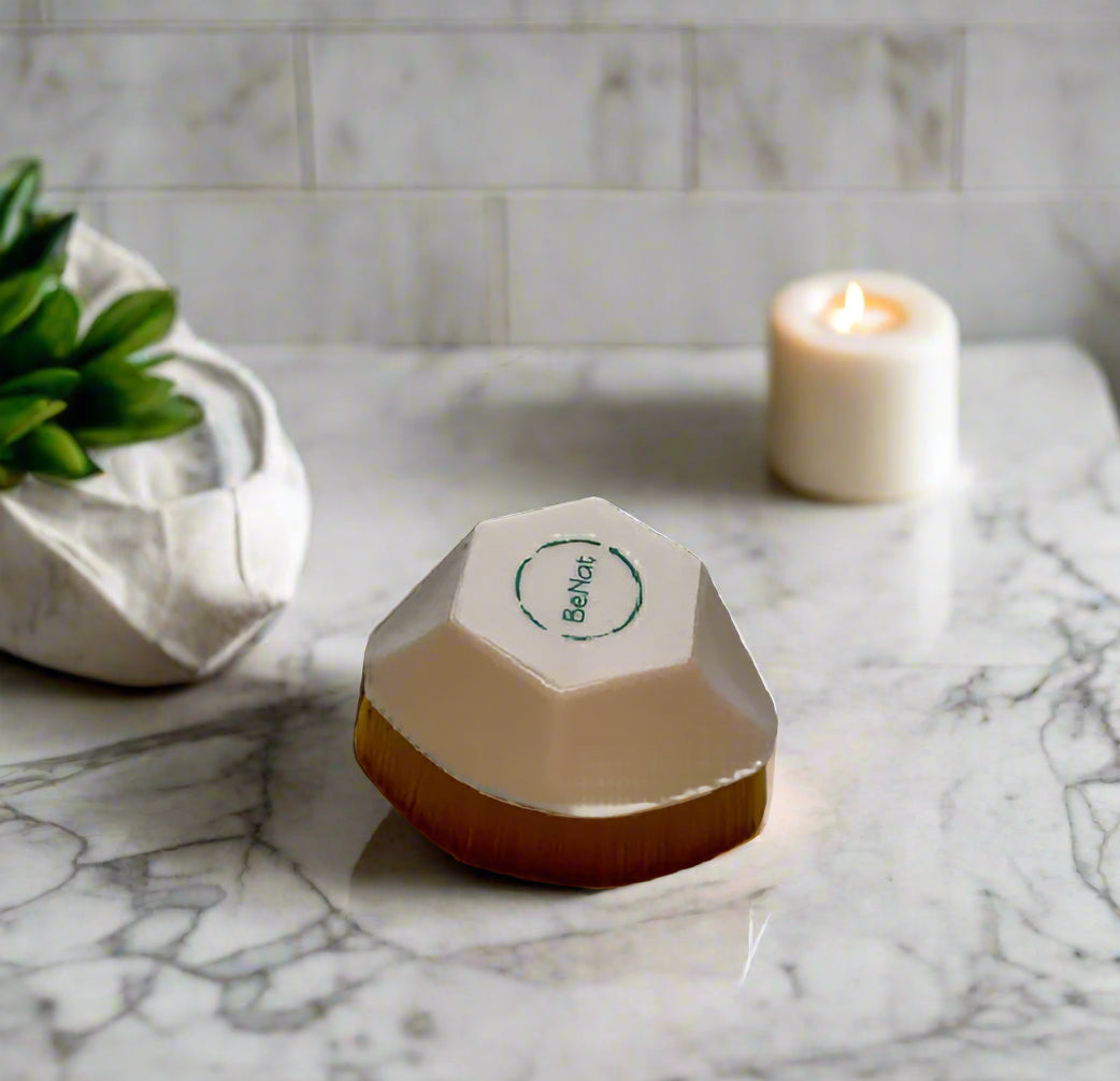 Hexagonal object with a brown base and clear container on a white background